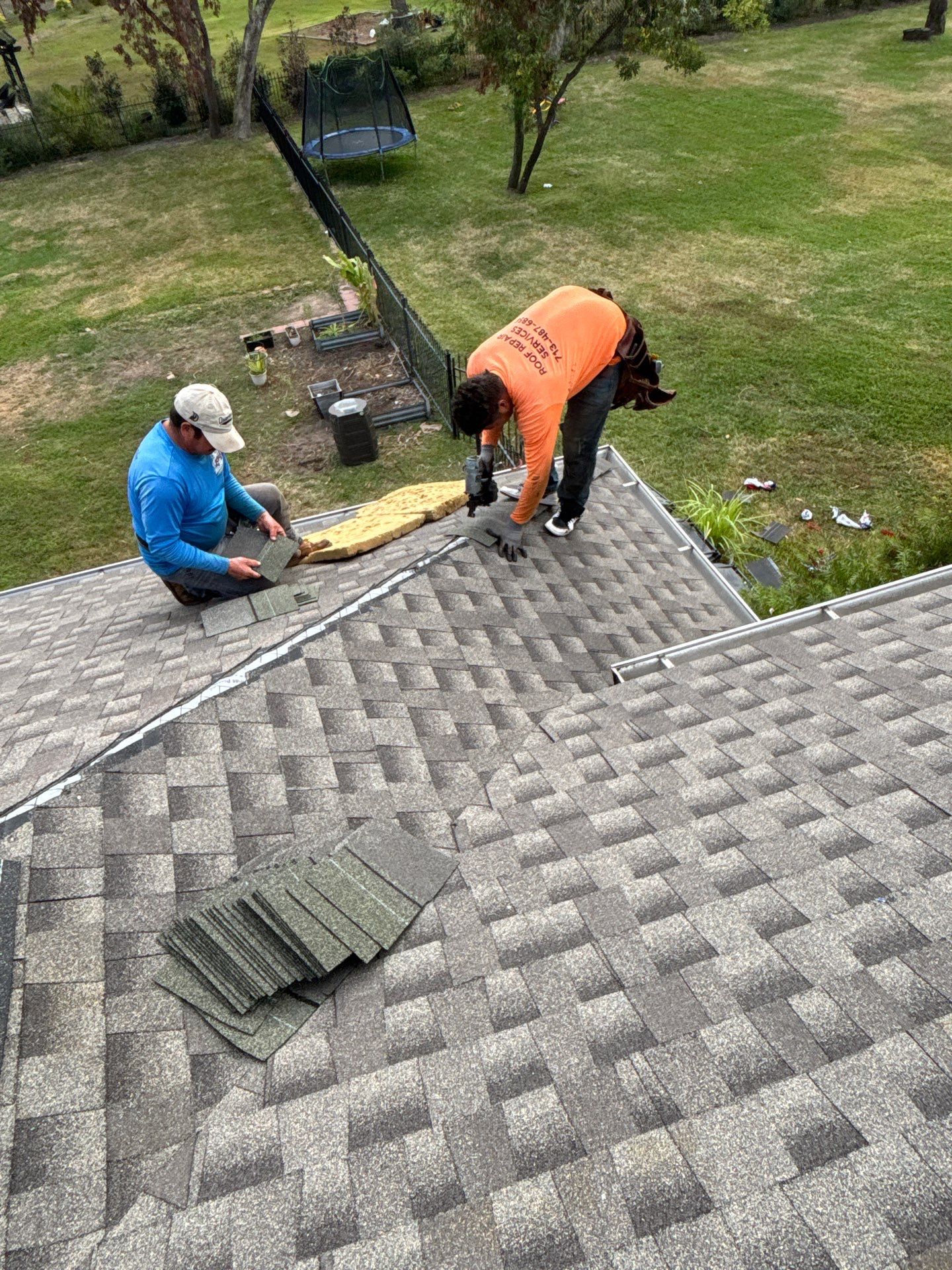 Katy, TX roof repair crew installing GAF architectural asphalt shingles after storm damage — Roof Repair Services Houston roofing contractor
