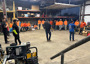 Roof Repair Services crew at morning safety meeting in Rosenberg, TX